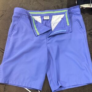 Izod Men's Flat Front Golf Shorts in Blue